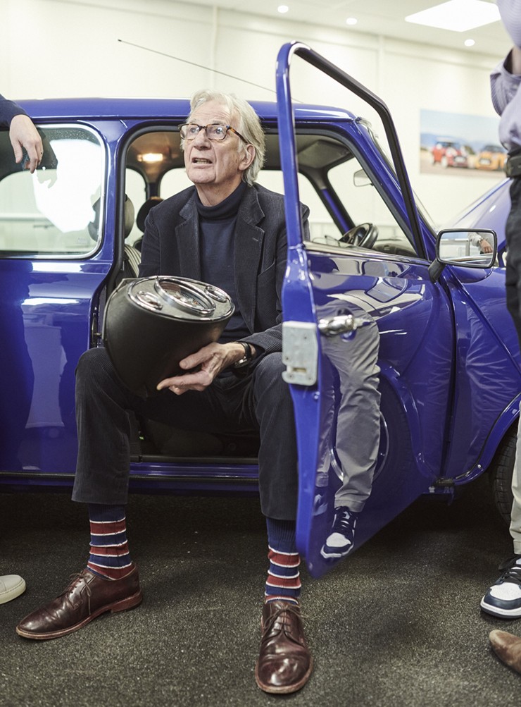 Paul Smith in the driver's seat talking to staff Paul Smith in the driver's seat talking to staff